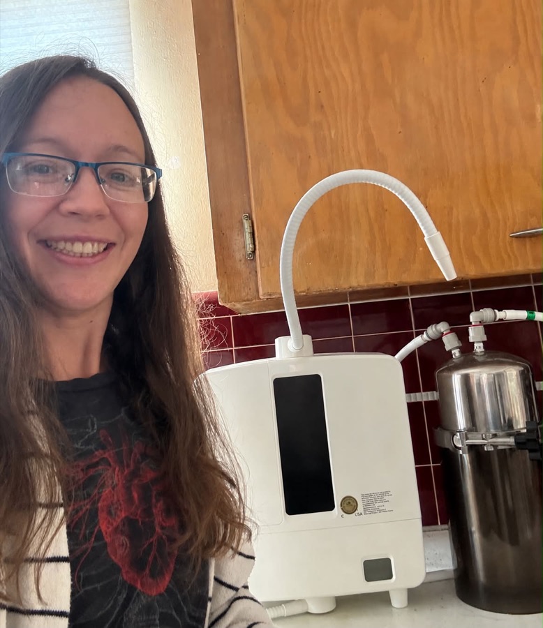 Leah preparing structured, molecular hydrogen water for an event